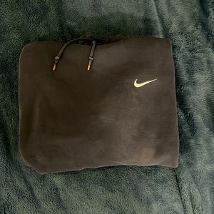 Nike dark blue with white logo on the front, size XL